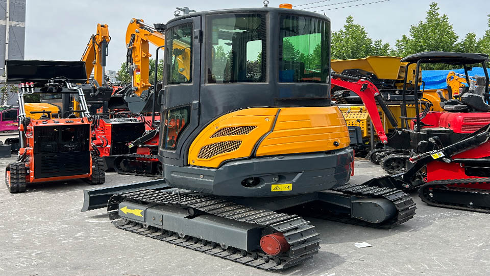 How does the excavator's tail swing impact its maneuverability?